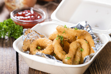 Onion Rings on wooden background