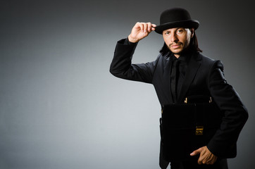 Businessman wearing vintage concept with briefcase