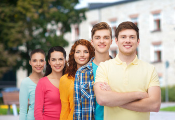 group of smiling teenagers over campus background