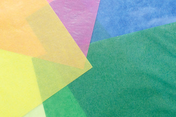 colorful translucent construction paper sheets thrown together