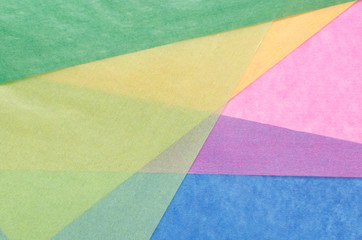 colorful translucent construction paper arranged irregularly 