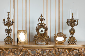 Antique clock with candlesticks.