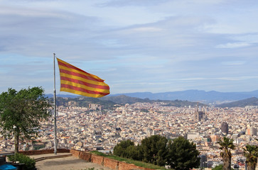 Fototapeta na wymiar Catalonian flag over Barcelona