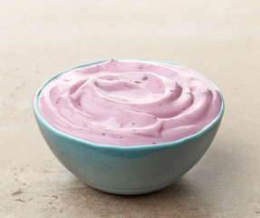 bowl of pink blueberry yogurt