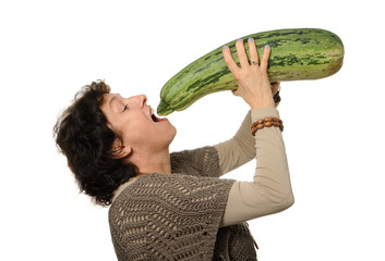 Woman holding big courgette (zucchini)
