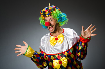 Funny clown in colourful costume