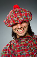 Funny scotsman in traditional clothing