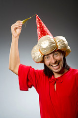 Funny wizard wearing red dress