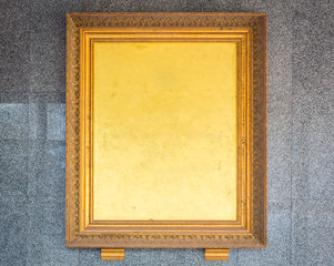 Antique golden frame on wall