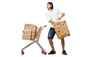 Man shopping with supermarket basket cart isolated on white