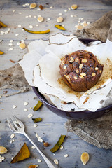 rustic muffin with pumpkin chocolate and oat flakes on bowl