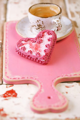 red heart cookies and espresso Coffee cup on old wooden table