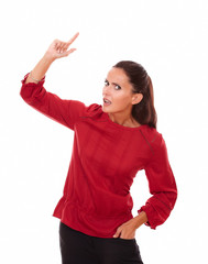Surprised lovely woman pointing up while standing