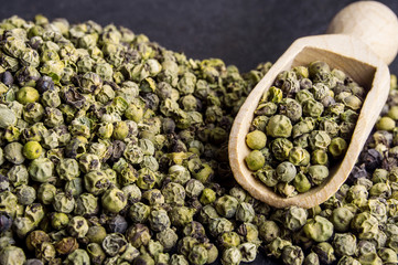 Wooden shovel with  green peppercorn