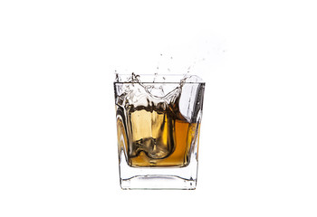 Whisky with ice cubes splash