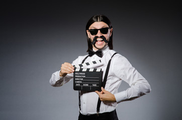 Funny man with movie clapboard