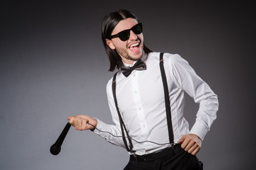 Funny singer with microphone at the concert
