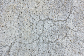 Old worn and cracked asphalt with cracks