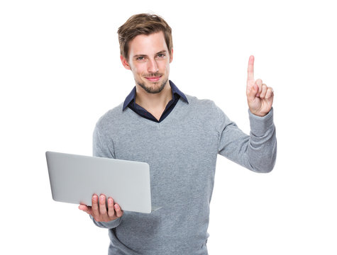Man With Laptop And Finger Point Up