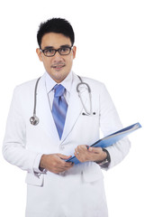 Asian doctor holding medical document
