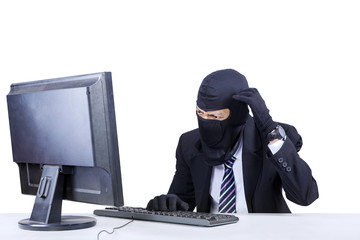 Confused hacker in business suit