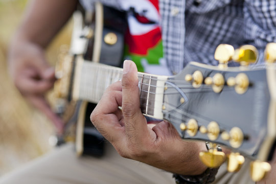 playing acoustic guitar