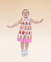 Cheerful adorable little girl jumping.