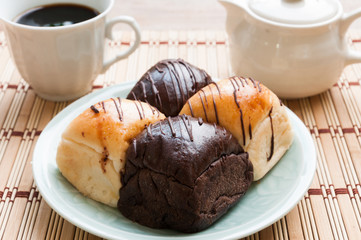 Freshly baked two- color bread loaf with cup of coffee