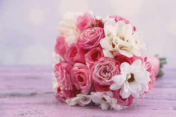 Beautiful wedding bouquet on table on bright background