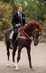 Fototapeta premium groom on horse