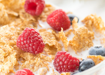 Cereal flakes with fresh raspberry closeup