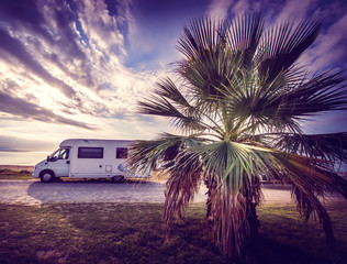 Camper van parked on a beach