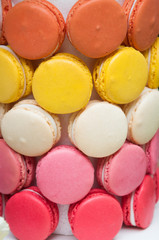 Colourful tasty macaroons in a row