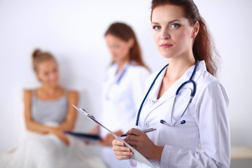 Portrait of woman doctor at hospital with folder