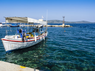 Obraz premium Fishing boat against clear blue sky,Alonissos Island,Greece