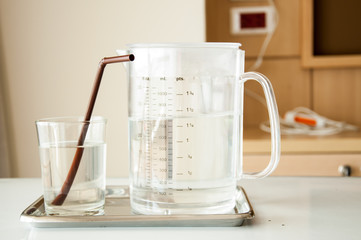 Glass of water in hospital room
