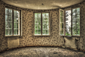 Dilapidated living room in an abandoned house