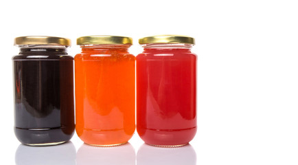 Blueberry, strawberry and orange fruit open lid bottled jam 