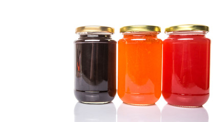 Blueberry, strawberry and orange fruit open lid bottled jam 
