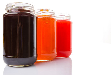 Blueberry, strawberry and orange fruit open lid bottled jam 