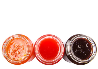 Blueberry, strawberry and orange fruit open lid bottled jam 