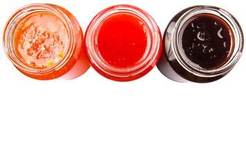 Blueberry, strawberry and orange fruit open lid bottled jam 