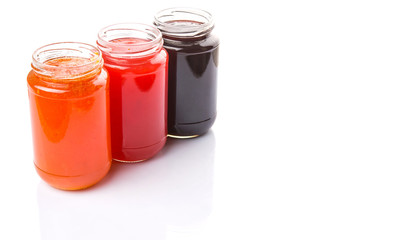 Blueberry, strawberry and orange fruit open lid bottled jam 