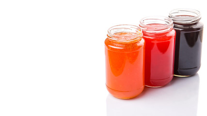 Fototapeta na wymiar Blueberry, strawberry and orange fruit open lid bottled jam 
