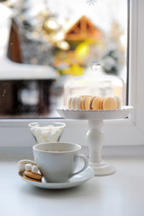 Coffee and sweets on the window