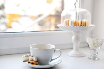 Coffee and sweets on the window