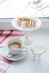 Coffee and sweets on the window