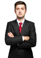 Young businessman with crossed arms
