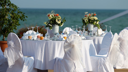 Outdoor Table Setting at Wedding Reception by the Sea