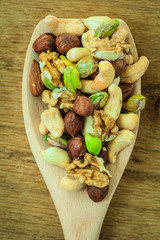 Varieties of nuts: cashew, pistachio, almond.